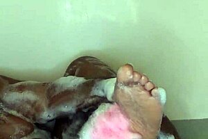 ebony woman enjoys bath time massage