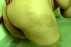 Mature tetona teases in the steamy bathroom.