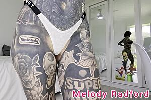 Melody radford tries on pink micro bikini with chain