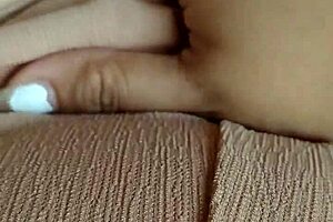 horny asian milf fingers her pussy while boyfriend is away.