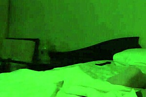 A married couple of reasonable age involves themselves in vigorous sex in their home
