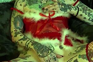 Tattooed milf with glasses and piercing achieves solo orgasm on shelf during Christmas