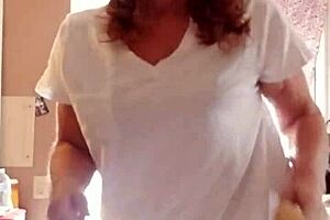 An aging beauty continued applying her lotion on her attractive body