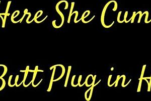 A hairless housewife uses a butt plug to achieve an orgasm