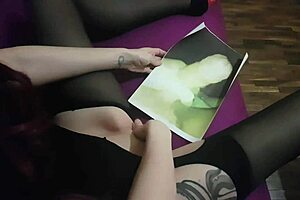 Enjoying and squirting on a picture of a fun cock