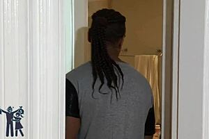 African American milf with bouncing boobs in short action scene.