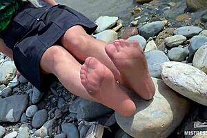 A seductive MILF in tan nylons teases outdoors