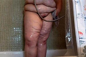 Big natural tits and bubble butt in a shower scene