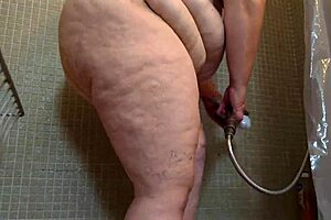 Big natural tits and bubble butt in a shower scene