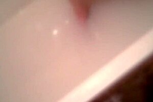 Mature beauty's steamy bath time show