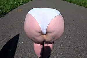 So, this girlfriend strapped on and banged a curvy milf by the car. Wild outdoor lesbian action!