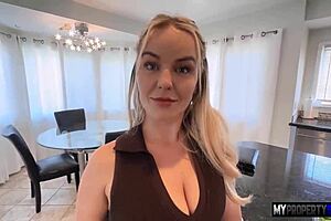 Slim and attractive real estate agent Vic in action at work