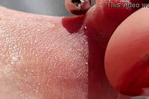 Mature amateur's pierced nipples up close