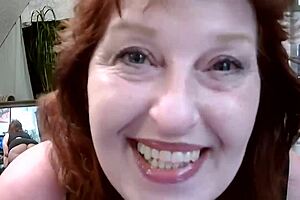 Old redhead flaunts curves and seduces in retro miniskirt