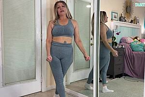 See Tabitha in workout clothes trying on different sizes in a homemade video