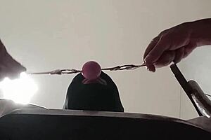 Blindfolded milf in latex, ballgagged, takes deep pulls