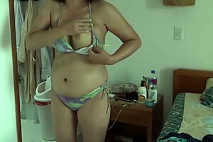 Stepmother on Beach in Bikini, Showing Off for a Lucky Guy. Who Wants to Join Her?