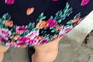 I follow and lift the skirt of a woman on the street