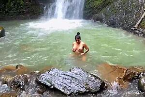 Woman walks naked in river, guy joins her