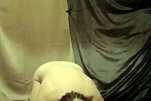 An enslaved slave's patee is eaten by a cock