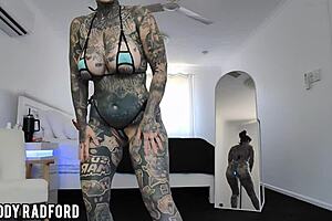 Hot milf tries on bikini with LED butt plug