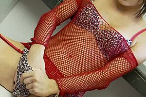 Brunette slut in red suit fishnet grabs big cock from glory hole! 🔥