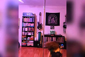 A hot girl in black lingerie shakes her ass for rock music