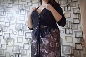 An Asian girl with big natural tits indulges passionately
