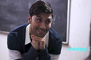 Latina Student Learns From Teacher In Classroom