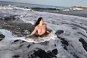 A hot mature woman asked her stepson to pose with her on the nude beach