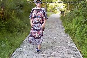 Hairy mature flashes in see-through dress on street