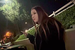 Artemisia Love smoking outdoors.