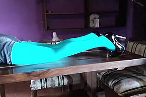 Beautiful Milf In Pantyhose And Heels Lies On The Table. Teasing With Her Sexy Legs.