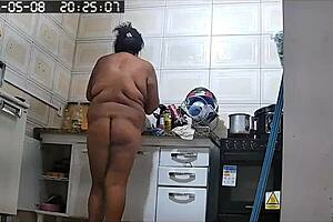 I caught my hot neighbor on camera tidying up and she showed her big pussy