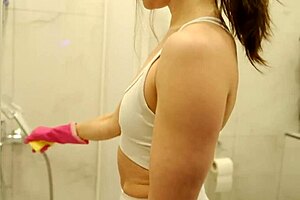 Cleaning Lady Spotted in Your Bathroom Doing Her Job. She’s Tidying Up Every Corner with Care.