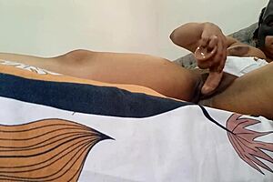 My delicious prostitute teases her pussy on the bed's edge