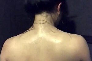 asian wife plays with dildo and vibrator in gym shower