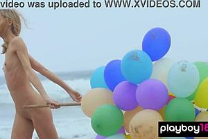 skinny italian milf blondie playing with balloons on the beach, so fun