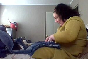 Wife patiently teaches folding clothes at home