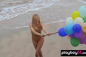 skinny italian milf blondie playing with balloons on the beach, so fun
