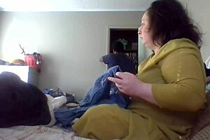 Wife patiently teaches folding clothes at home