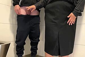 Juicy MILF caught wanking a cock in a public hairy toilet