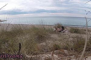 Look at this French teacher slut giving a public blowjob on nude beach with cumshot!