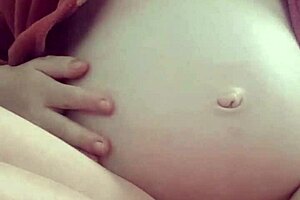 Pregnant milf masturbates with natural tits, contrasting her solo pleasure.