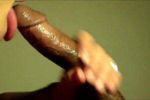 Cougar enjoys sucking cum from a young black teen's dick in close-up deepthroat action