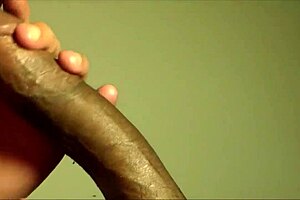 Cougar enjoys sucking cum from a young black teen's dick in close-up deepthroat action