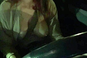 Artemisia Love flashes big tits during night car ride