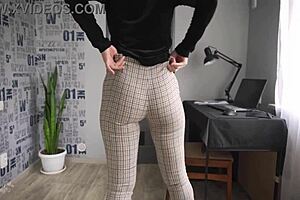 Office worker displays curves in tight trousers