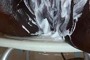 Black MILF shaves pussy on camera