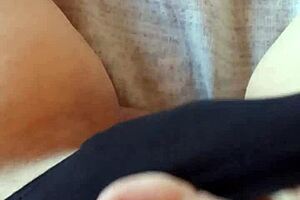 Gretala sensually poses in her black slip